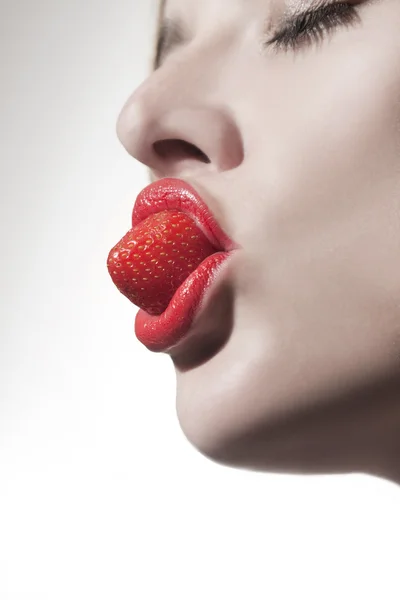 Eating strawberries Royalty Free Stock Images