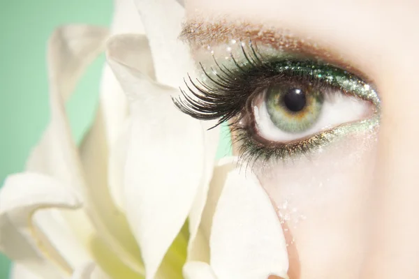 Face of a beautiful girl with white lily — Stock Photo, Image