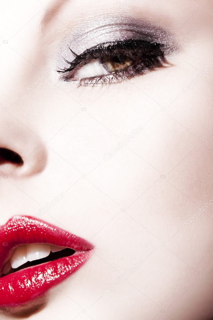The girl's face with red lips close-up