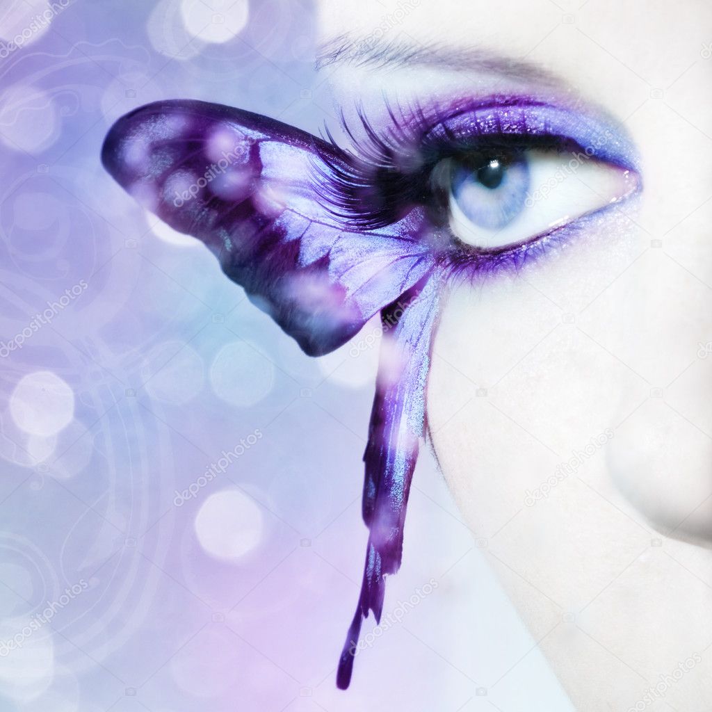 Beautiful woman eye close up with butterfly wings