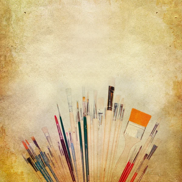 Vintage shabby chic background with paint brushes — Stock Photo, Image