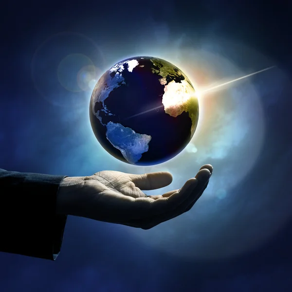 Hand protecting earth — Stock Photo, Image