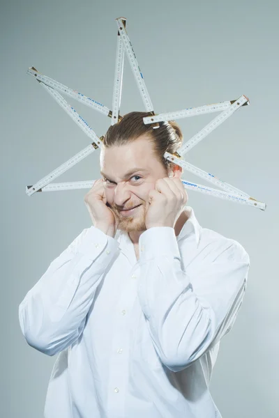 Humorous man with folding yardstick — Stock Photo, Image