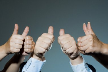 Group holding thumbs up clipart