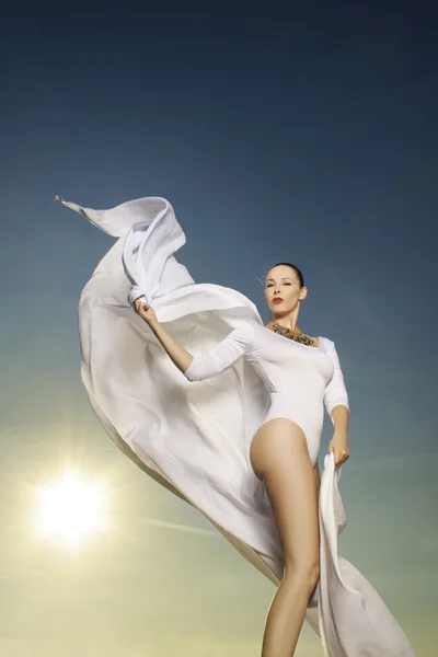 Beautiful woman in white dancing — Stock Photo, Image