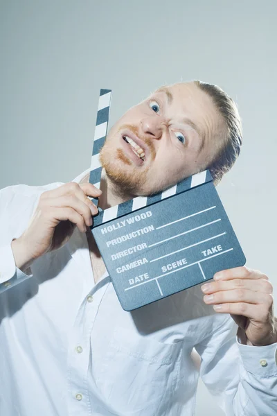 Joven con aplauso de película — Foto de Stock