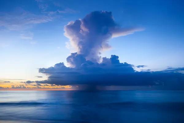 Rain cloud above the ocean