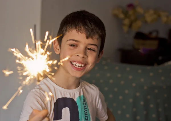 Child with a sparkler in hand — Stock Photo, Image