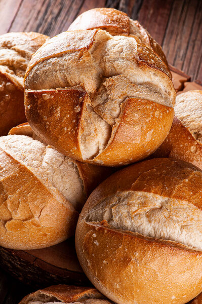 Various types of naturally fermented breads together in a basket