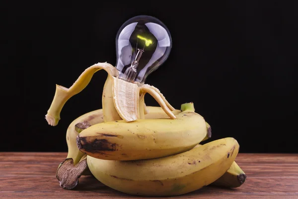 Bananas surrounding a bulb — Stock Photo, Image