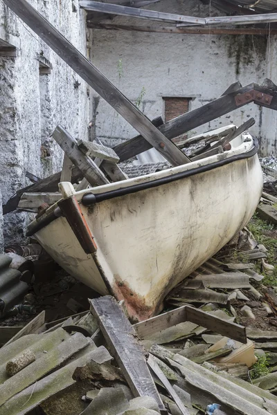 Abandoned boat among the ruins — Stock Photo, Image