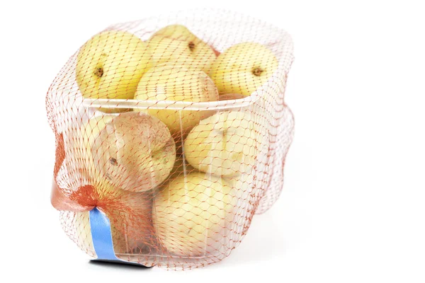 Apricots in a mesh — Stock Photo, Image