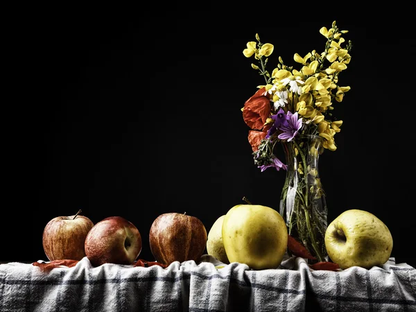 Still life with flowers and apples on a wooden board — Stock Photo, Image