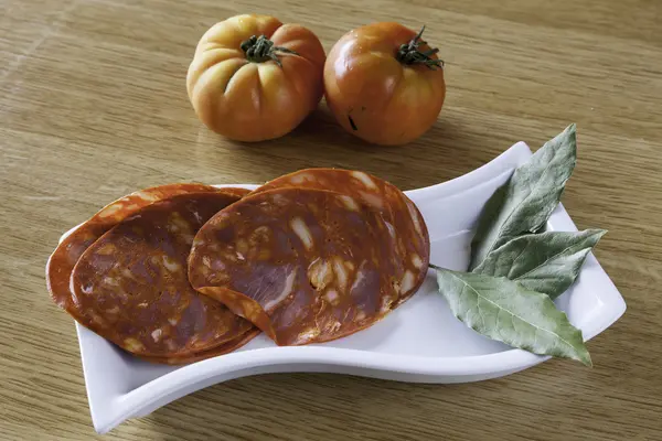 Fresh sausage on a plate — Stock Photo, Image