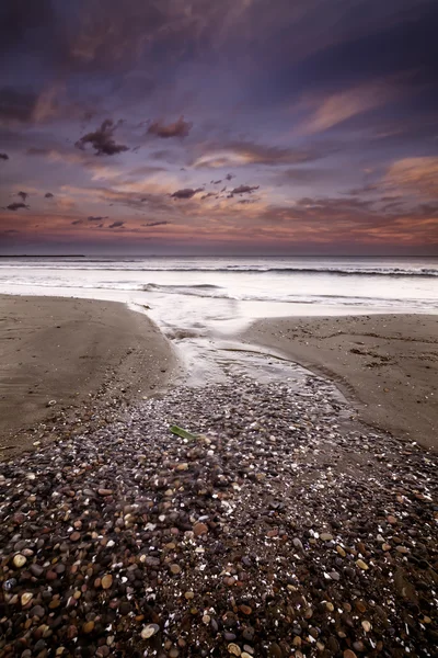 Paesaggio di una spiaggia al tramonto — Foto Stock