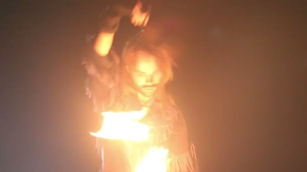 Bearded man in fire performance — Stock Video