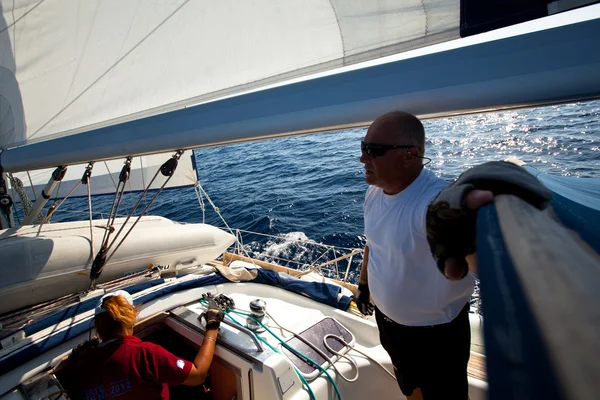 SARONIC GULF, GREECE - SEPTEMBER 23: Sailors participate in sailing regatta "Viva Greece 2012" on September 23, 2012 on Saronic Gulf, Greece — Stock Photo, Image