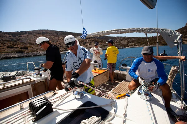 SARONIC GULF, GREECE - SEPTEMBER 23: Sailors participate in sailing regatta "Viva Greece 2012" on September 23, 2012 on Saronic Gulf, Greece. Stock Image