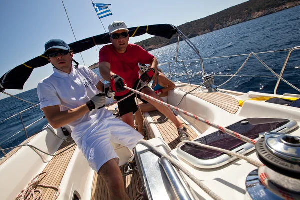 SARONIC GULF, GREECE - SEPTEMBER 23: Sailors participate in sailing regatta "Viva Greece 2012" on September 23, 2012 on Saronic Gulf, Greece. Royalty Free Stock Photos