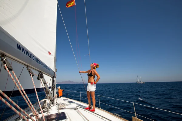 SARONIC GULF, GREECE - SEPTEMBER 23: Sailors participate in sailing regatta "Viva Greece 2012" on September 23, 2012 on Saronic Gulf, Greece. Royalty Free Stock Photos