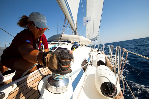 SARONIC GULF, GREECE - SEPTEMBER 23: Sailors participate in sailing regatta "Viva Greece 2012" on September 23, 2012 on Saronic Gulf, Greece Royalty Free Stock Images