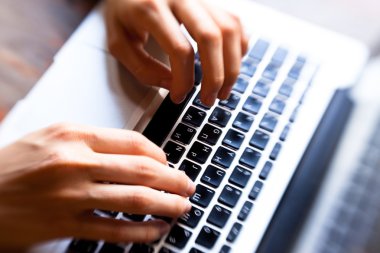 Hands typing on computer keyboard clipart