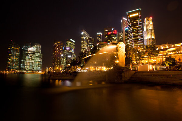 City of Singapore at night, Marina Bay with water reflections.