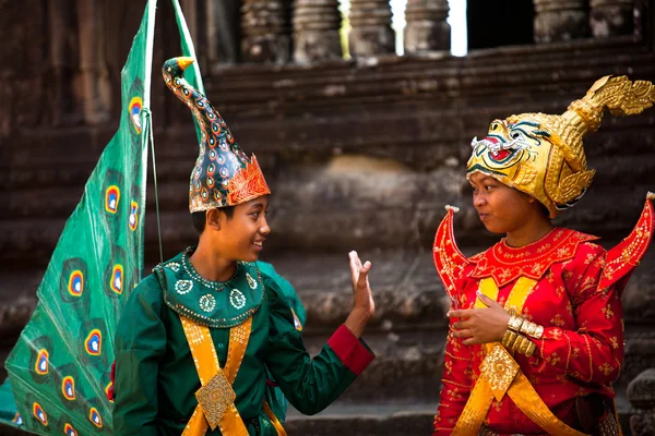 SIEM REAP, CAMBODIA - DEC 13: An unidentified cambodians in national dress poses for tourists in Angkor Wat Stock Picture