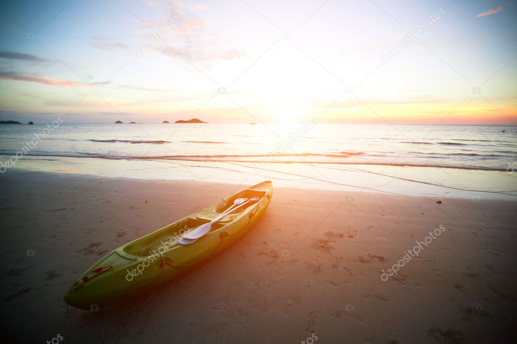 Kayak at the tropical beach at sunset.