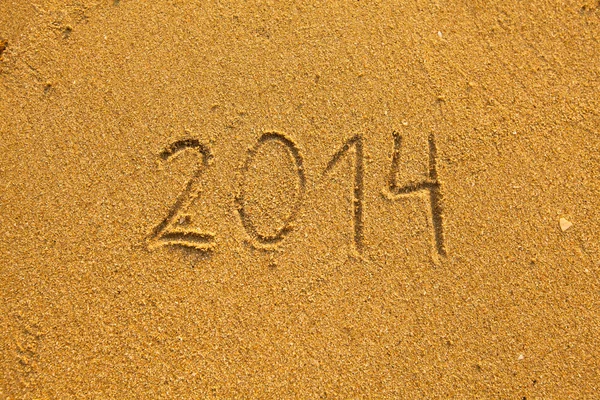 2014 written in sand on beach texture Stock Picture