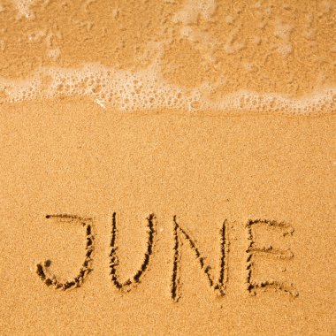 Haziran - kum plaj doku - yumuşak dalga deniz üzerinde yazılı..