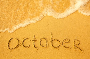 Ekim - kum plaj doku üzerinde yazılı.