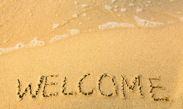 Bem-vindo - escrito na areia — Fotografia de Stock