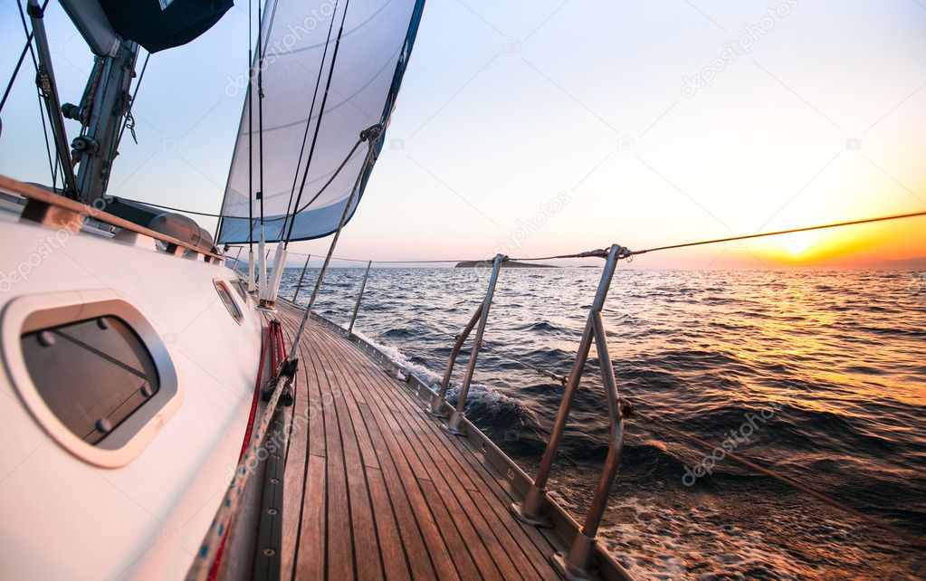 Sailing regatta in Greece, during sunset.