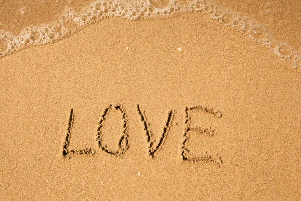 Love - written in sand — Stock Photo, Image