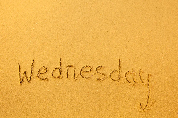 Wednesday - written in sand texture. — Stock Photo, Image