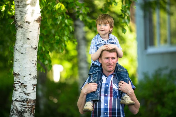 Portrait of father and son outdoors Royalty Free Stock Images