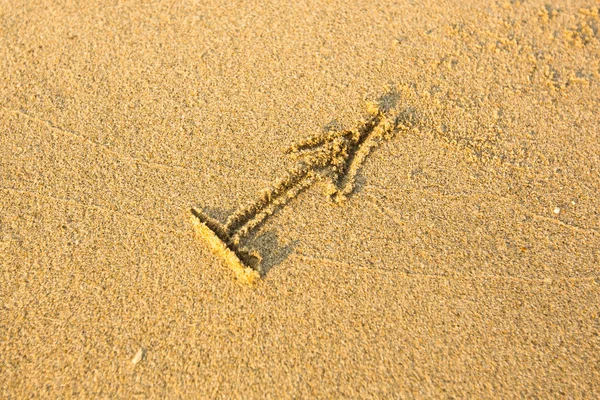 Sternzeichen Sagittarius, gezeichnet auf dem facture Strand Sand. — Stockfoto