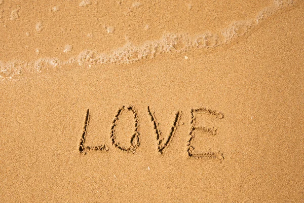 Love - written in sand — Stock Photo, Image