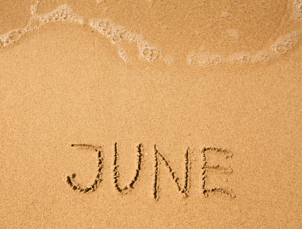 6 월-모래에 작성 된 — 스톡 사진