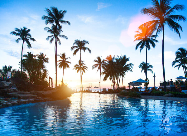 Beautiful sunset at a beach resort in tropics.