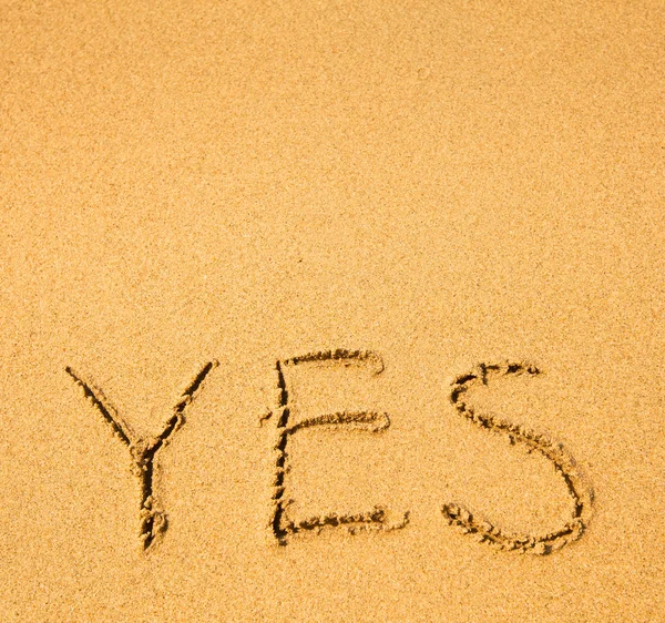 Ja - geschreven in zand — Stockfoto