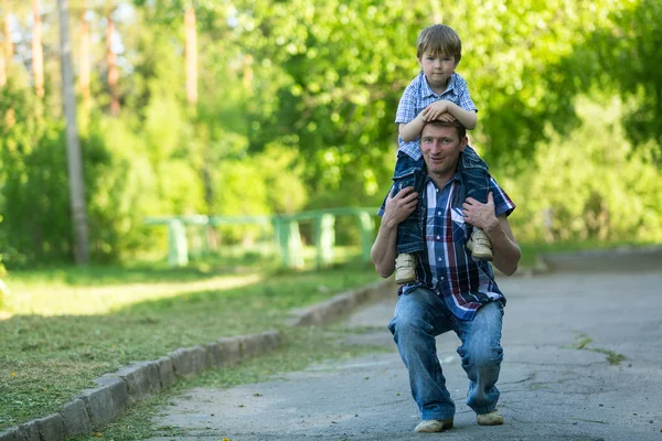 Father and son outdoors. Stock Photo