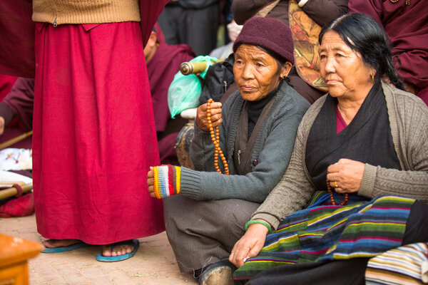 Unidentified Buddhist pilgrims near stupa Boudhanath