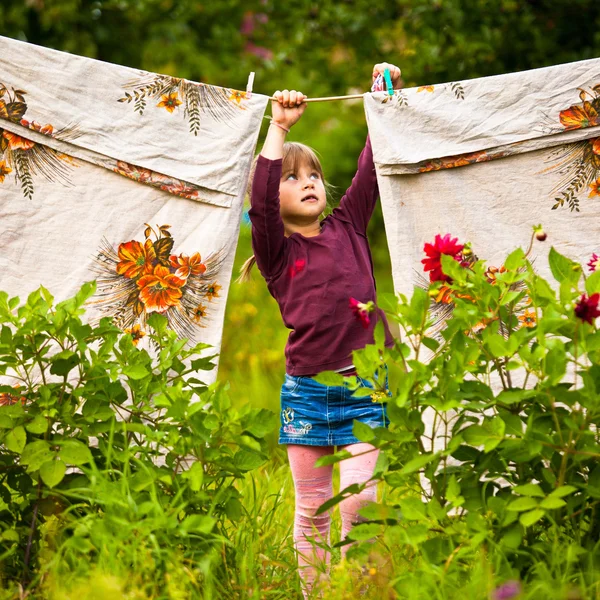 Little five-year girl with clothespin outdoor — Stock Photo, Image