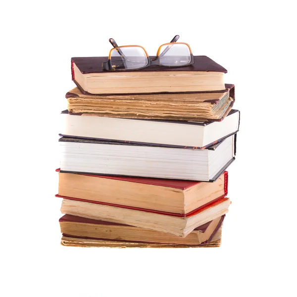 A pile of different books and glasses — Stock Photo, Image