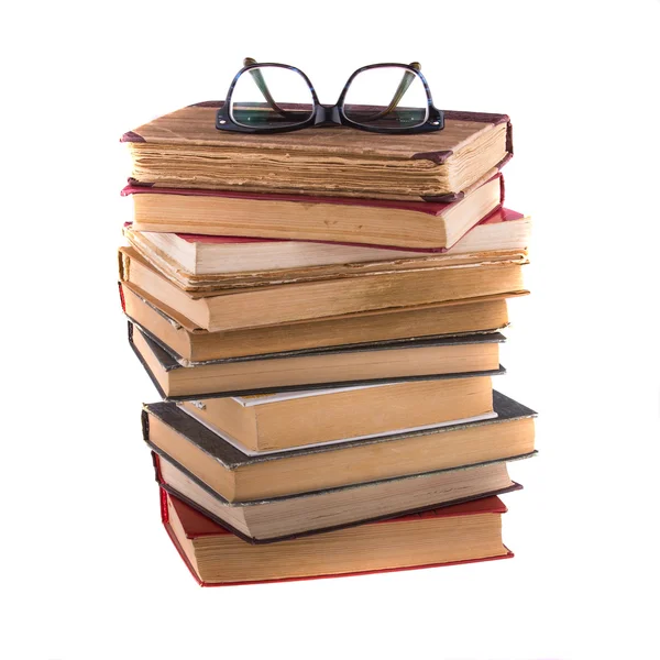 Stack of old books and spectacles — Stock Photo, Image