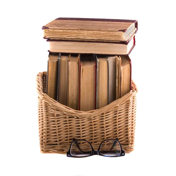 Stack of old antique books in basket — Stock Photo, Image