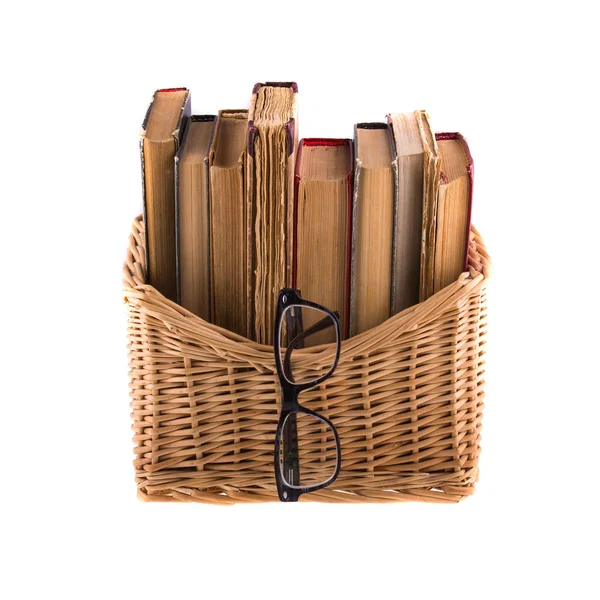 Stack of old antique books in basket — Stock Photo, Image