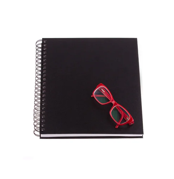 Spiral notebook, glasses — Stock Photo, Image